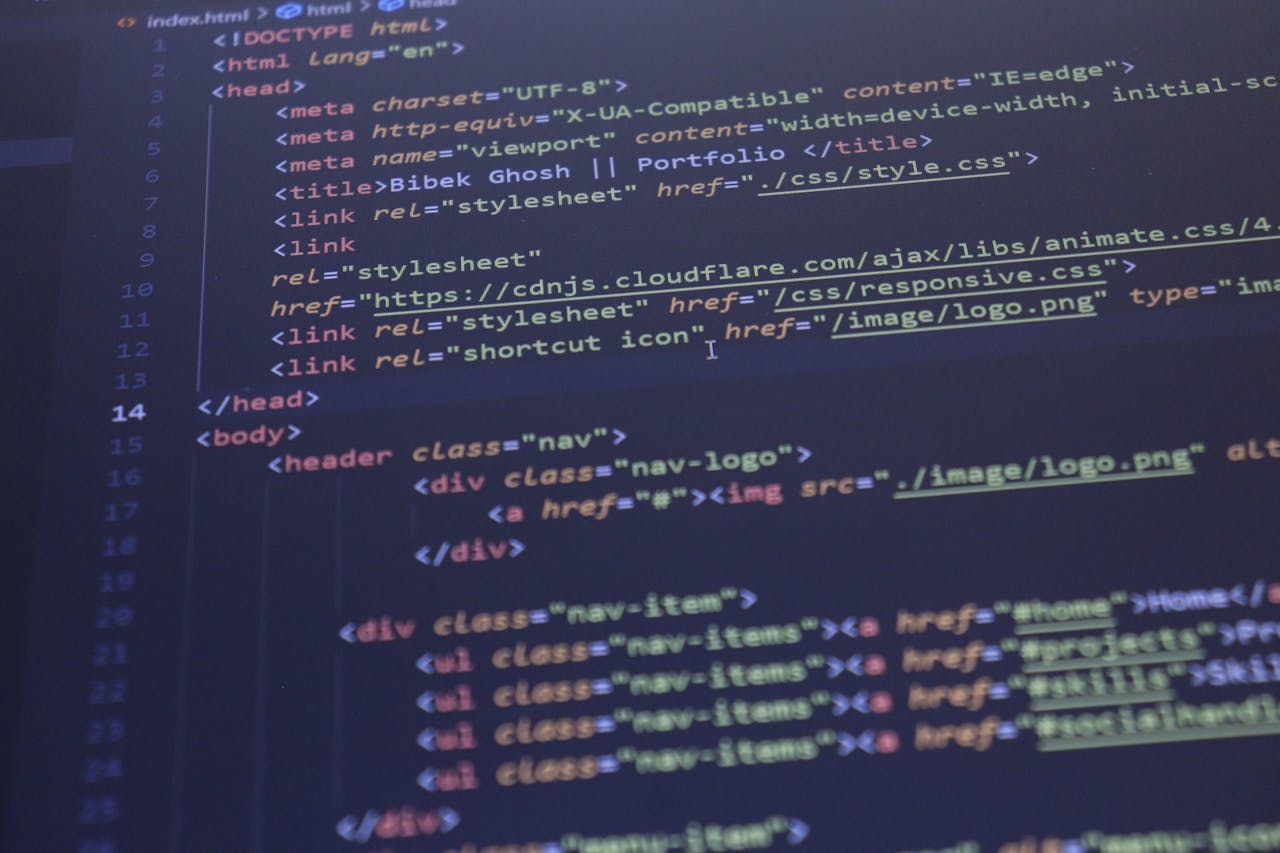services-03 Close-up view of HTML and CSS code displayed on a computer screen, ideal for programming and technology themes.